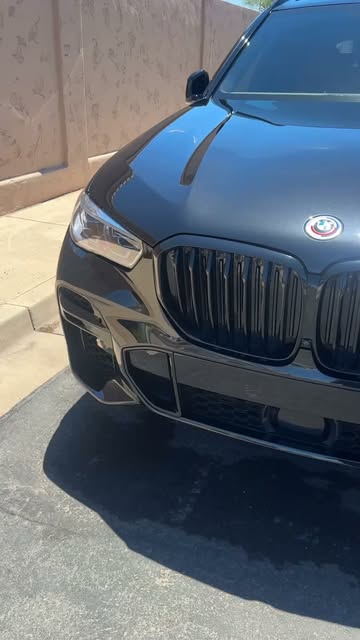 Glossy black BMW exterior photographed in bright Arizona sun